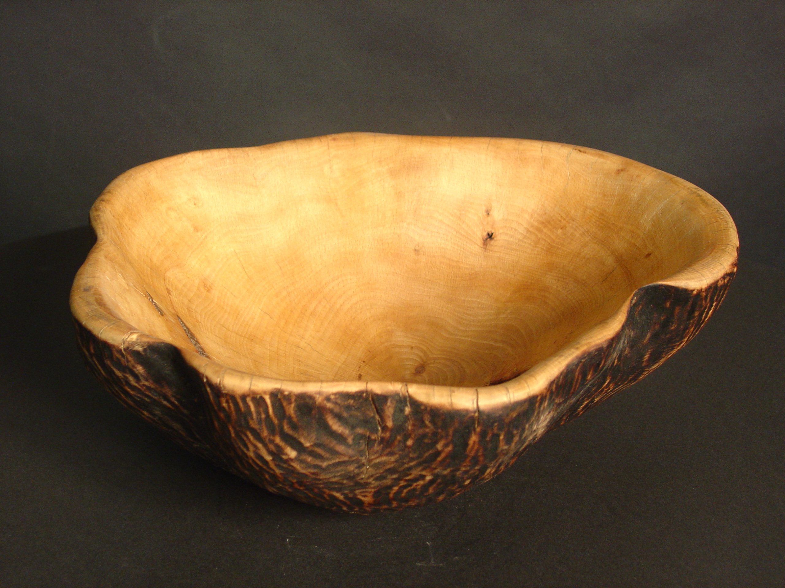 a large bowl carved from wood