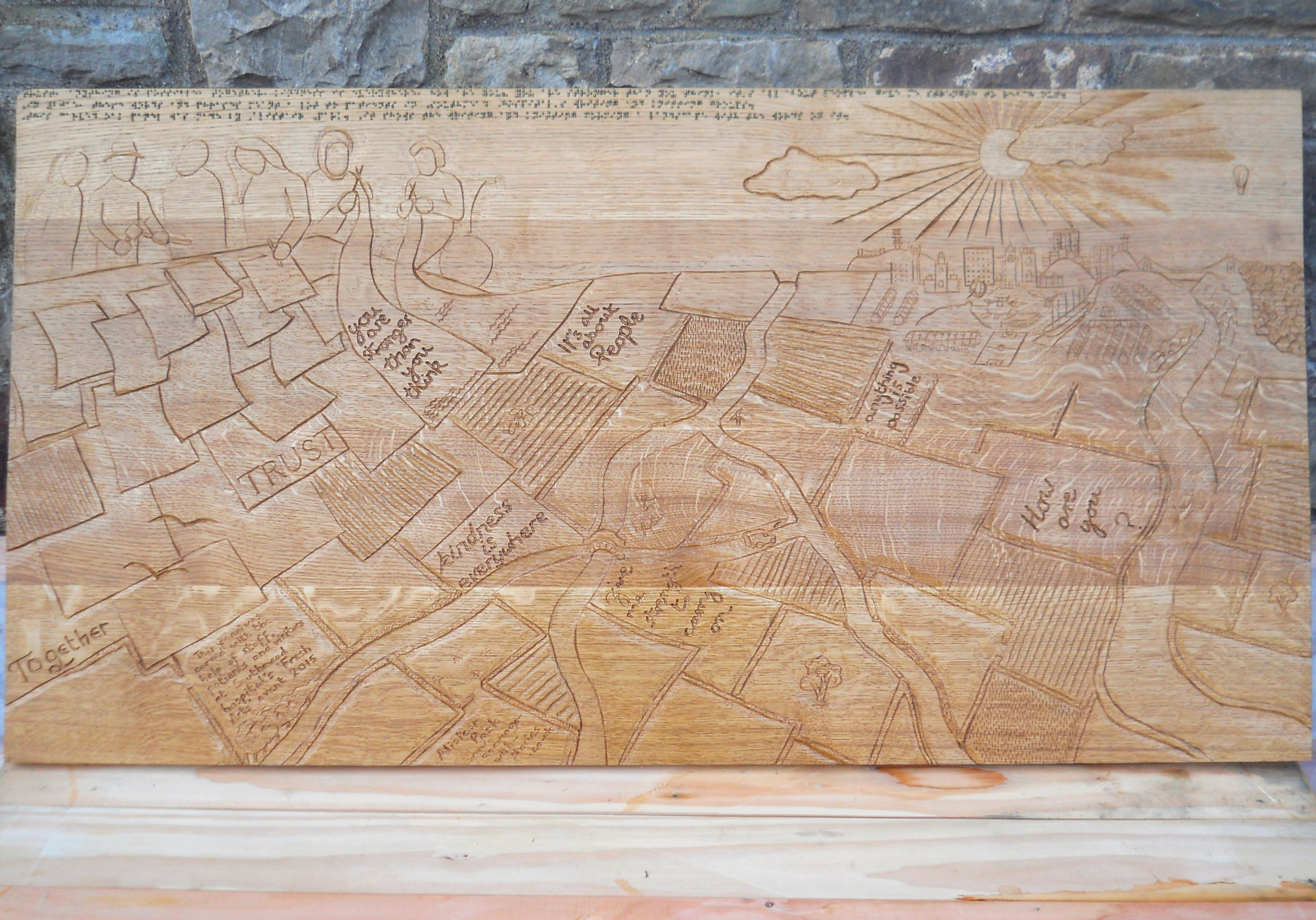 wooden panel relief carving with braille