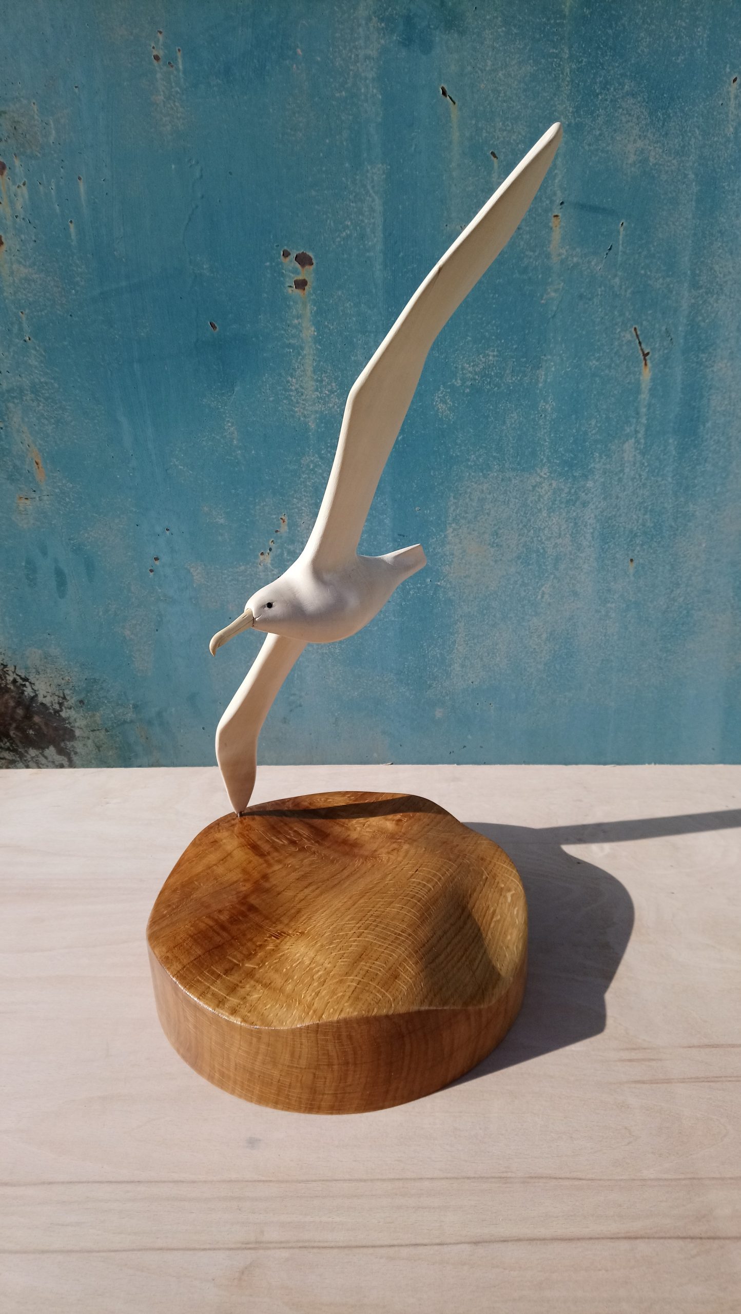 Wooden sculpture of an albatross flying
