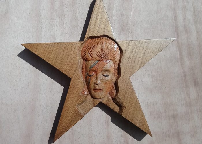 Woodcarving of David Bowie as Aladdin Sane